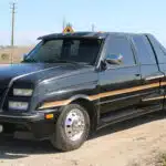 There’s a 1990 GMC Dually Pickup Buried Under All This Fiberglass