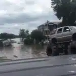 Watch a Lifted Cadillac Escalade Pull a Military Truck Out of Harvey’s Floodwaters